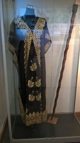 Tuaiwa (Eva) Rickard’s dress and pouwhenua. Photograph by Paora Tibble, Te Papa