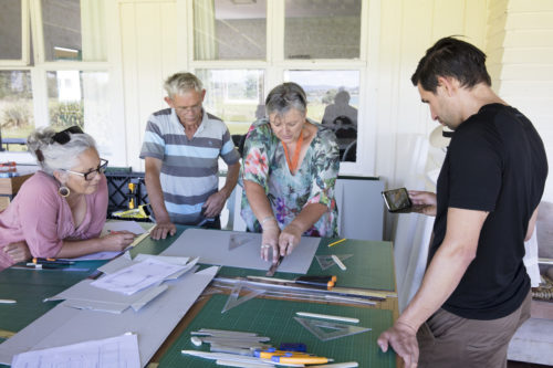 Vicki-Anne showing Katerina Mataira, Owen and Ihaia Greensill how it’s done. Photograph Maarten Holl, Te Papa